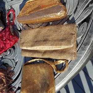 Three gold evening bags